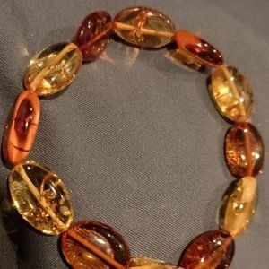 unisex 7.5 smooth oval beads from Lithuania  multi-colored stretch bracelet